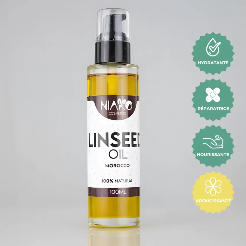 Flacon d'huile de lin cosmétique NIAKO de 100ml avec des étiquettes indiquant 'HYDRATANTE', 'RÉPARATRICE', 'NOURRISSANTE' et 'ADOUCISSANTE'.